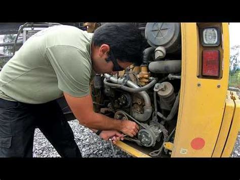 How to Change Engine Belts on a Skid Steer Cat 259D 